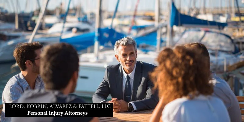 Boat accident lawyer: secure your rights and maximize your recovery 5 Lawyer discussing boating safety tips and legal rights with a group of boaters at a marina for legal awareness.